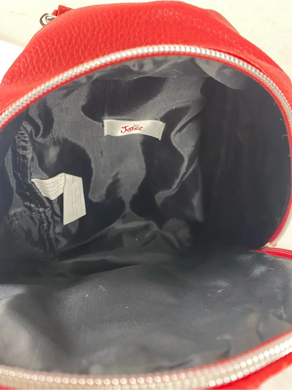 Justice Red Quilted Mini Backpack with Black Patch
